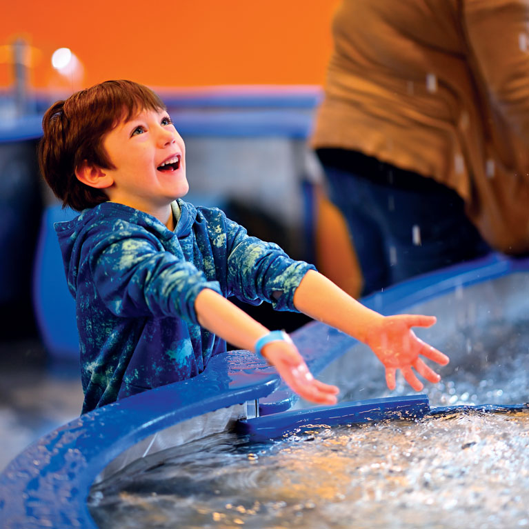 Roll up your sleeves and splash around in the water table in little kidspace®.